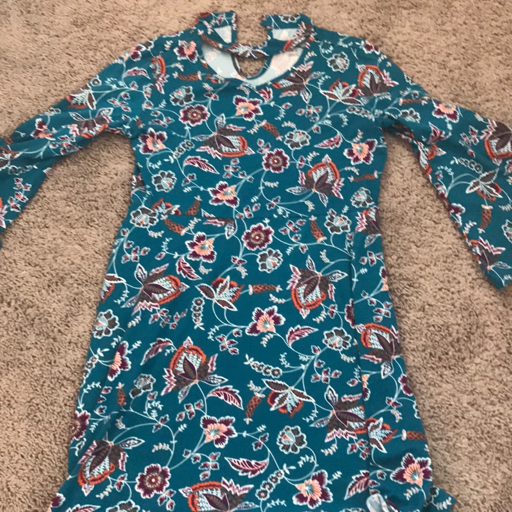 A dress that is a little broken with the button